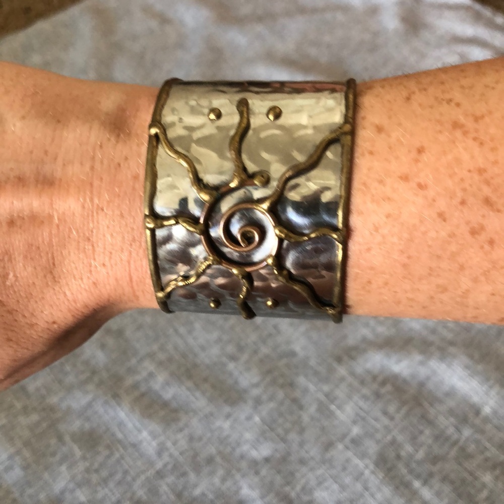 Textured silver bangle with sun detail